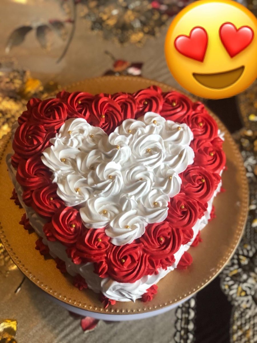 Heart-shaped cake piped with red and white roses